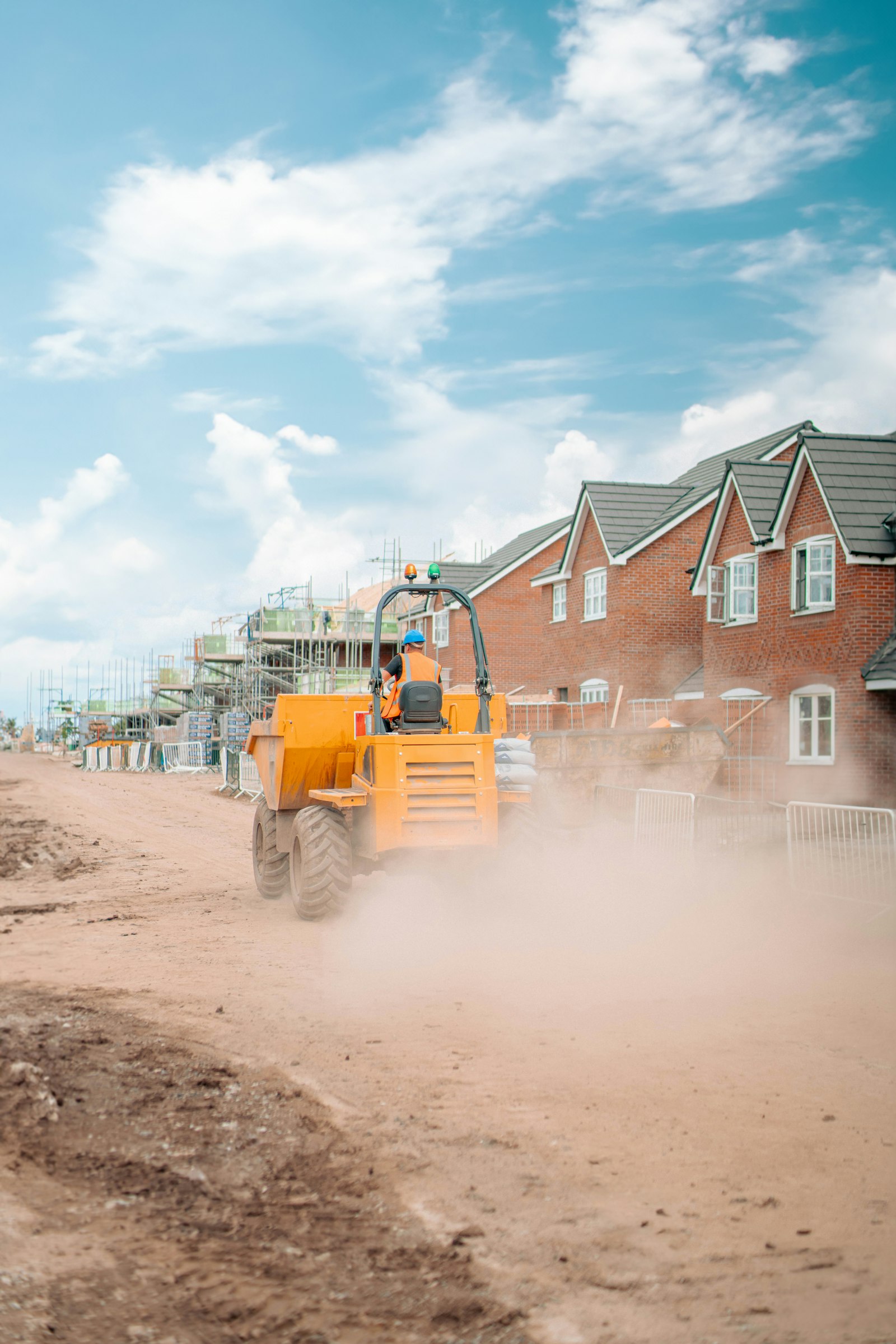 Site dumper with its driver on a new-build site